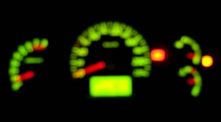 Car dashboard indicator illuminated at night