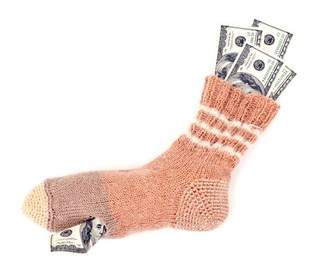 Dollars keeping in holed sock
isolated on white backgroundの写真素材
