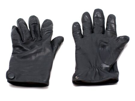Pair of black leather gloves isolated on white backgroundの写真素材