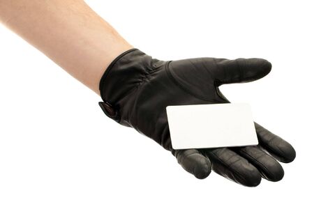 Hand in black leather glove holding credit card, isolated on white background の写真素材