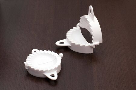 This device is a kitchen utensil for  preparation varenik and dumplingsの写真素材