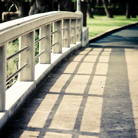 Shadow on the bridge in the parkの写真素材