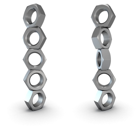 Two columns of screw nuts isolated on whiteの写真素材