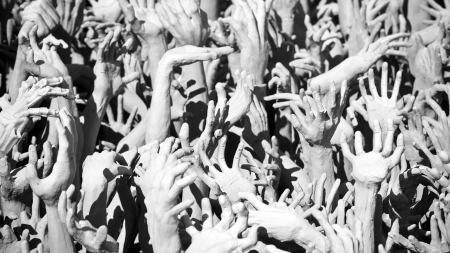 Hands statue from hell in Wat Rong Khun. Wat Rong Khun is a contemporary unconventional Buddhist temple in Chiang Rai, Chiangmai province, Thailand. It is designed in white color.の写真素材