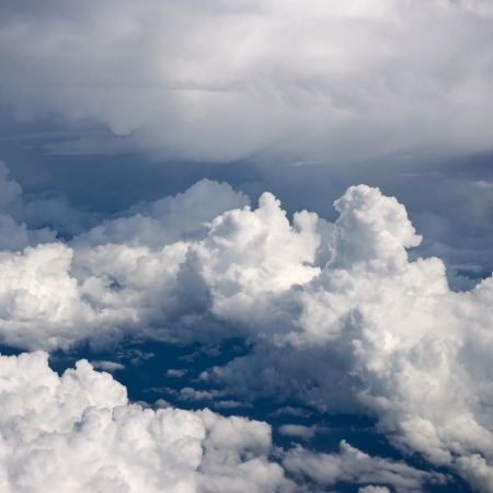 Aerial view on white fluffy cloudsの写真素材