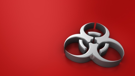 Metal biohazard symbol on red background with copyspaceの写真素材