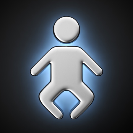 Metal symbol of a baby with backlight effect on the black backgroundの写真素材