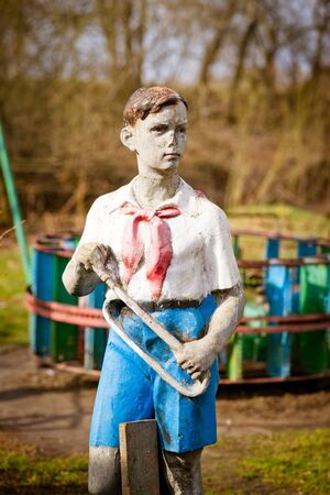 Old statue of soviet pioneer boyの写真素材
