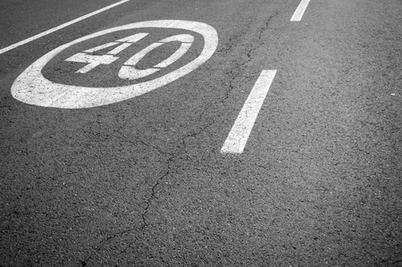 The speed limit signage on the asphalt road
