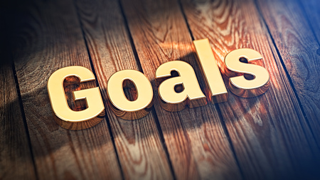 The word "Goals" is lined with gold letters on wooden planks. Should you give up on a dream goal? 3D illustration pictureの写真素材