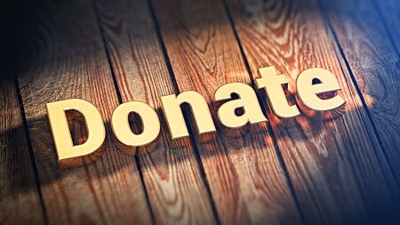 The word "Donate" is lined with gold letters on wooden planks. 3D illustration pictureの写真素材