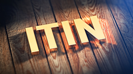 The acronym "ITIN" is lined with gold letters on wooden planks. 3D illustration imageの写真素材
