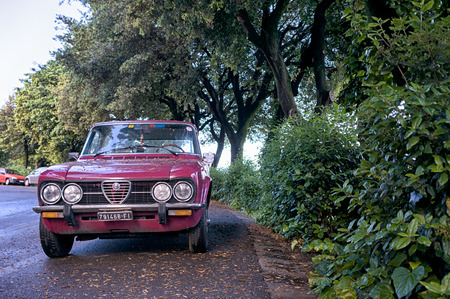 Florence, Italy - May 02, 2016. Retro Alfa Romeo car on the street of Florence. This model is Alfa Romeo Nuova Super 1300, manufactured in 1974-1977 yearsのeditorial素材