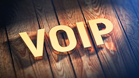 The acronym "VOIP" is lined with gold letters on wooden planks. 3D illustration imageの写真素材