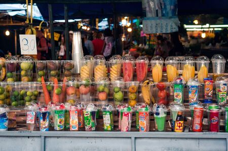 KRABI TOWN, THAILAND - JANUARY 19, 2017: Exotic fruit arranged in plastic cups for shaking a cocktail on thai market, Krabi town, Thailandのeditorial素材
