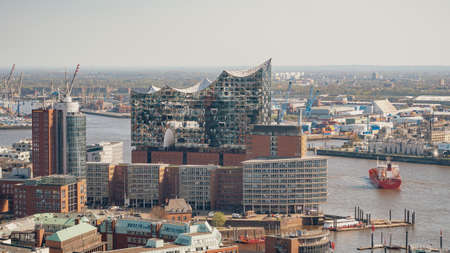Hamburg, Germany, 19 April 2018: The reflection of Hamburg cityscape in the glass wall of famous Elbe Philharmonic Hall, Germanyのeditorial素材