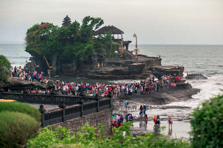 Bali, Indonesia - october 10, 2016: Pura Tanah Lot temple surrounded by water of the ocean and crowd of tourists, Bali, Indonesiaのeditorial素材