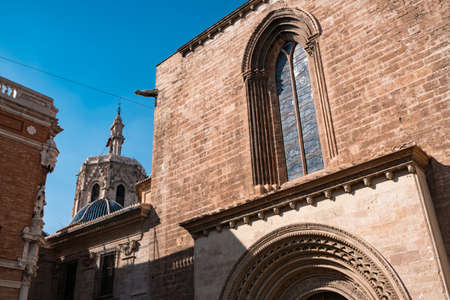 The bellfry El Miguelete of Valencian Cathedral. View from Plaza de la Almoina.の写真素材