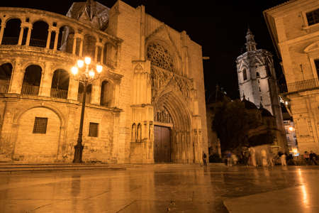 Valencia Cathedral on the Plaza de la Virgen at night. It is located in the historic center of Valencia.の写真素材