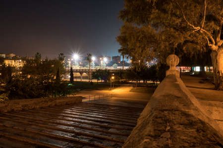 Stone steps from Serrans bridge to the Turia gardens in night illumination. Turia gardens are based in river bed In order to prevent the flooding.の写真素材