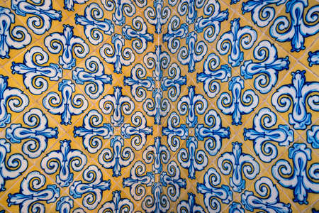 Colorful tiles with floral design on the wall of Mercado Central, Valencia, Spain. Arabesque background.