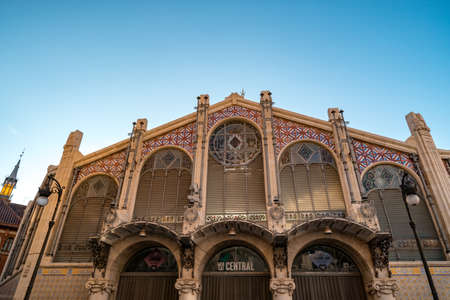 Valencia, Spain - 27.10.2019: Main entrance of Mercat Central early in the morning. Mercat central is a public market located in historic Valencia and famous for its architectural style - Valencian Art Nouveau.のeditorial素材