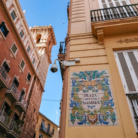 Valencia, Spain - November 02, 2019: Traditional ceramic decoration on the building on the square...