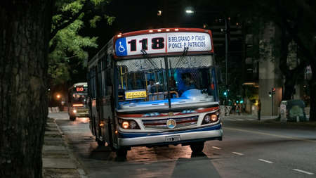 Buenos Aires, Argentina - December 11, 2017: City buses on the streets of evening Buenos Airesのeditorial素材