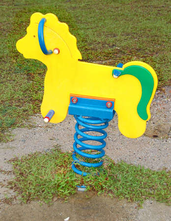 rocking horse in a parkの写真素材