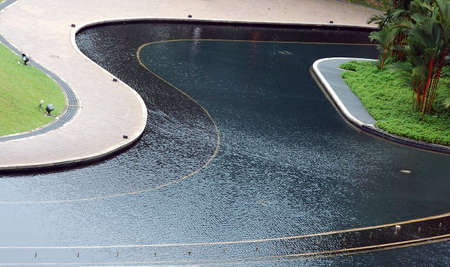 Public park fountain and walkway with patternsの写真素材