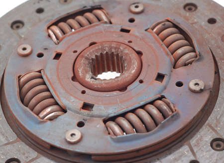 clutch plate just removed from a car showing wear out and dust springsの写真素材