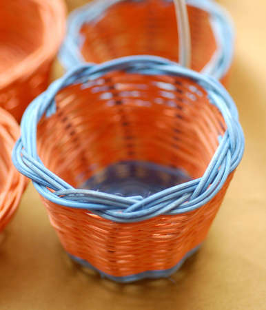 orange mini basket with blue rimの写真素材