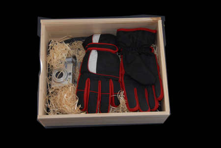 wooden box with packaging material ready to insert gift or presents in black back groundの写真素材