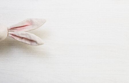 Easter spring bunny ears on white wooden backgroundの写真素材