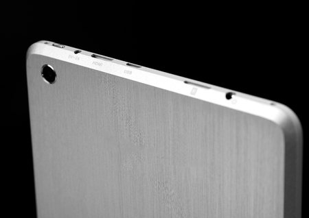 Tablet black silver metal on black background with shadow cutout isolated without screen sideの写真素材