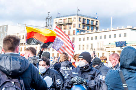Demonstration about the kurdish freedom moovement at the birthday of Ãcalan in Berlin. Demonstrating people hold banners and posters in the air.のeditorial素材