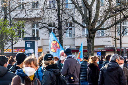 Demonstration about the kurdish freedom moovement at the birthday of Ãcalan in Berlin. Demonstrating people hold banners and posters in the air.のeditorial素材