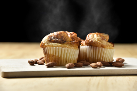 Hot Almond Danish Cupcakes on wooden background.の写真素材