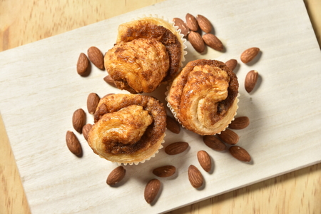Almond Danish Cupcakes on wooden background.の写真素材