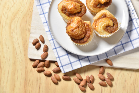 Almond Danish Cupcakes on wooden background.の写真素材