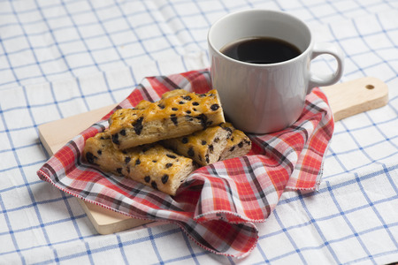 Chocolate chip sticks with coffee on table.の写真素材