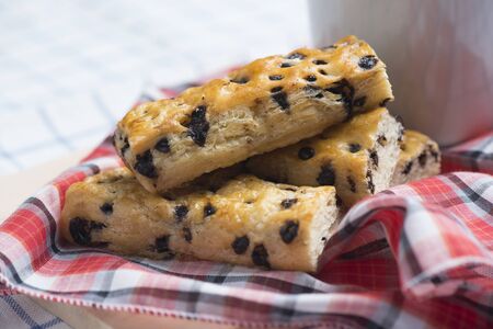 Chocolate chip sticks with coffee on table.の写真素材