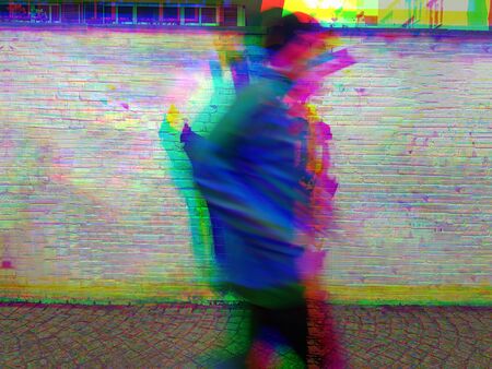 Photograph of a jogger passing by on a footpath, edited with video fx.の写真素材