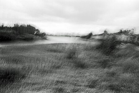 Blurred black and white analogue exposure of an industrial landscape.の写真素材