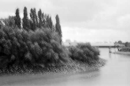 Blurred black and white analogue exposure of an industrial landscape.の写真素材