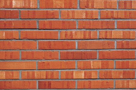 Abstract and pattern photography of a orange and yellow brick wallの写真素材