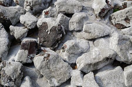 Abstract photography of cobblestones, partly fixed with light gray concreteの写真素材