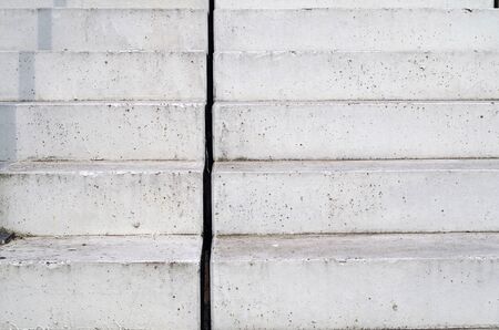 Abstract view of concrete stairs, leading upwards with a shade of the hand railの写真素材