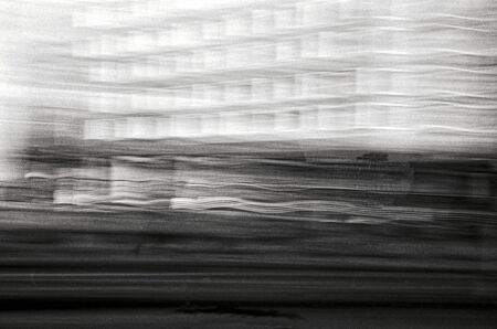 Blurred black and white analog photography of urban office buildingsの写真素材