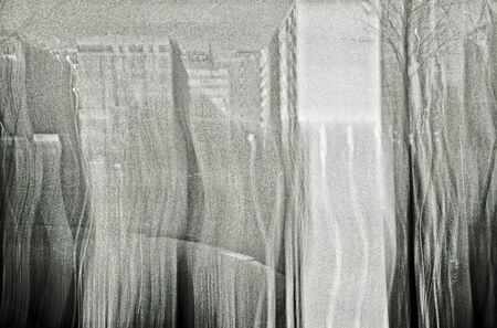 Blurred black and white analog photography of urban office buildingsの写真素材